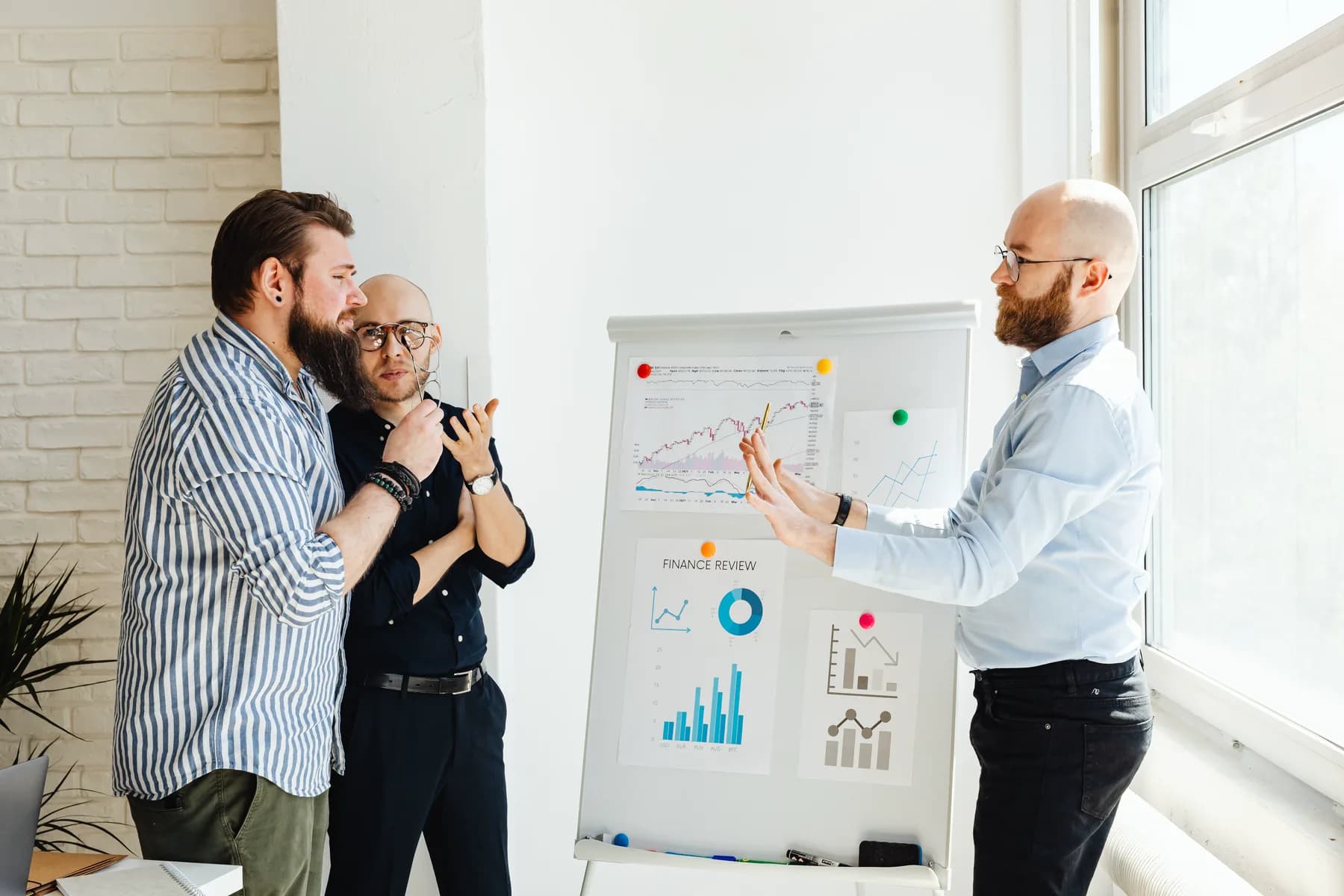 Investment team reviewing performance charts in a working session